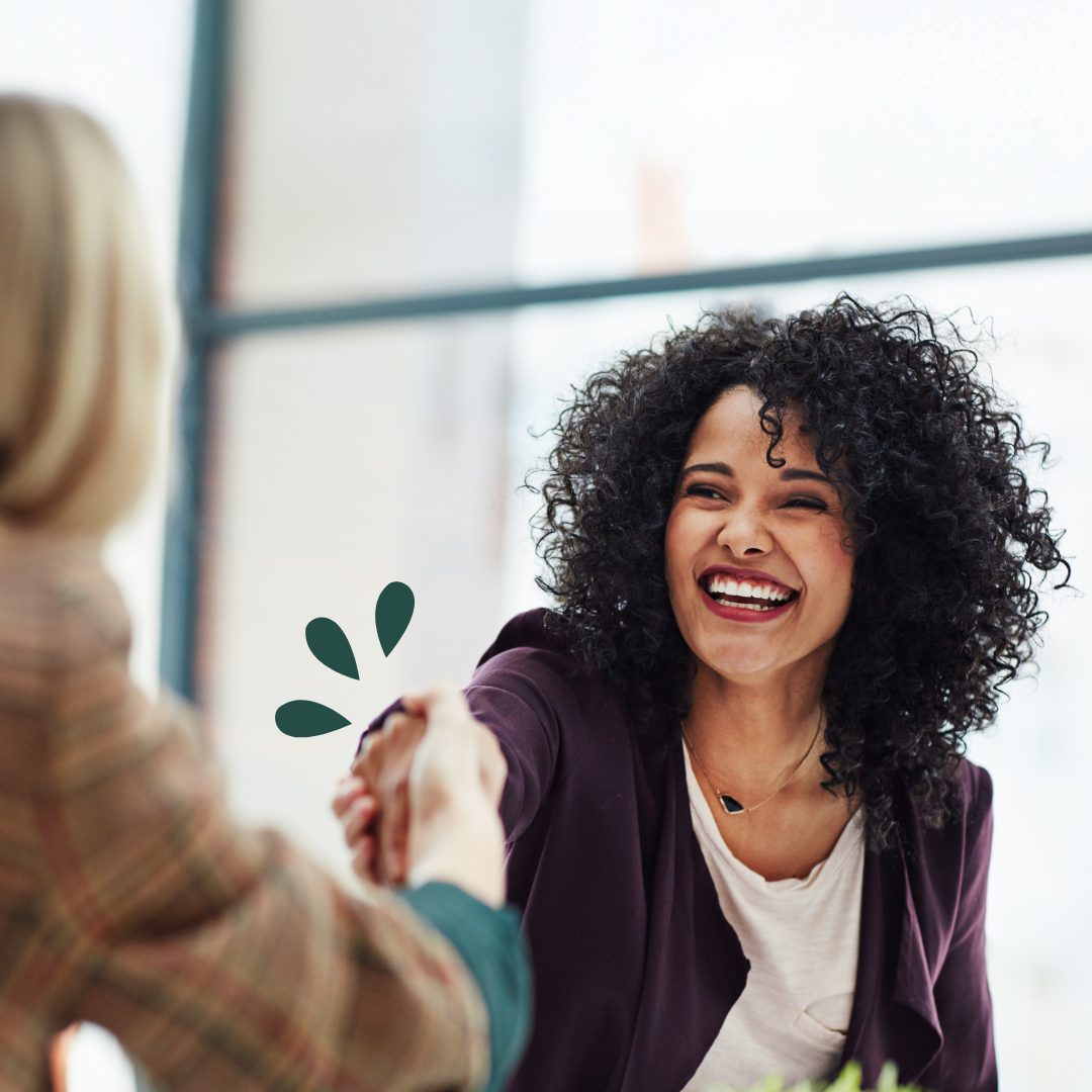Careers Woman shaking hands with an interviewer