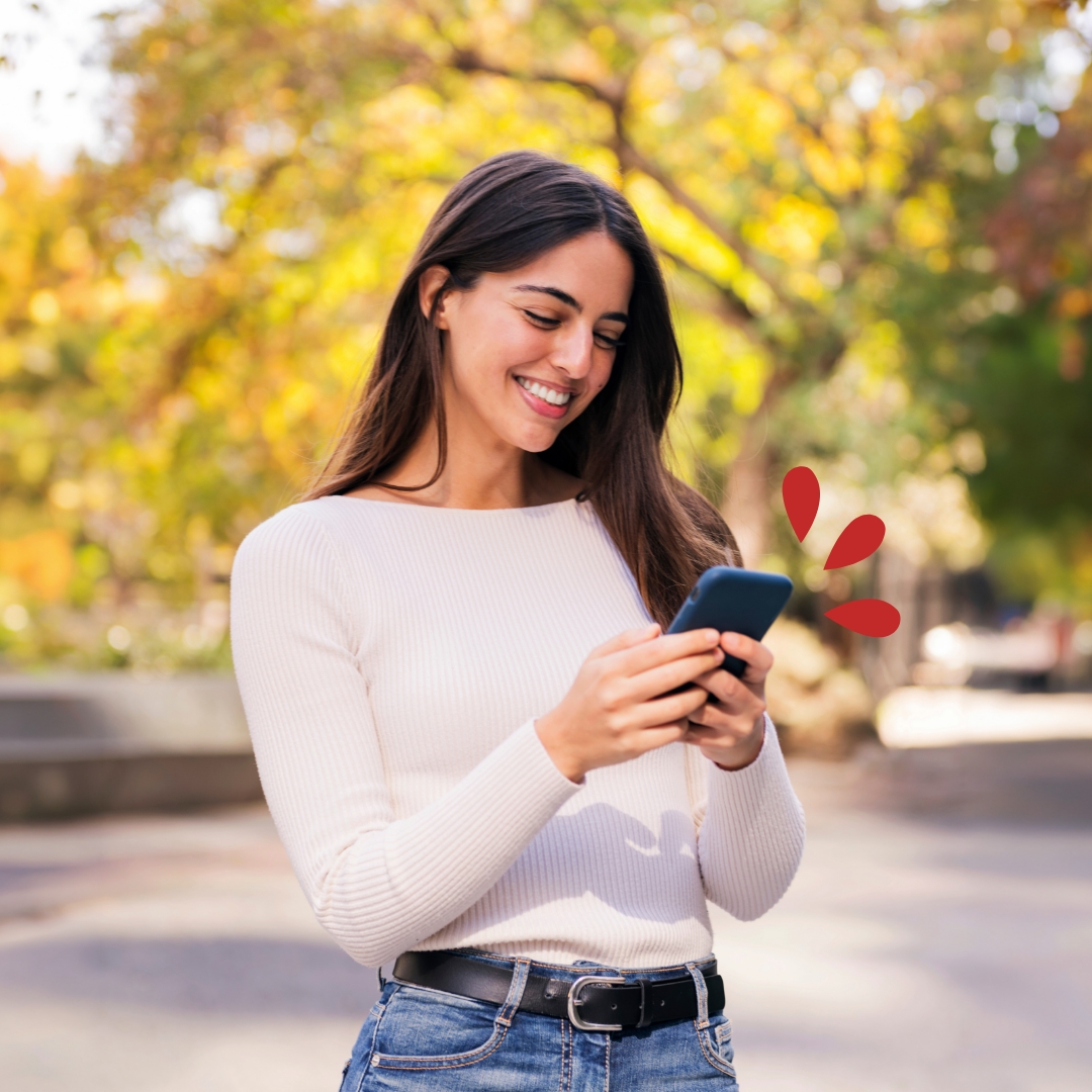 Young woman outside on her device