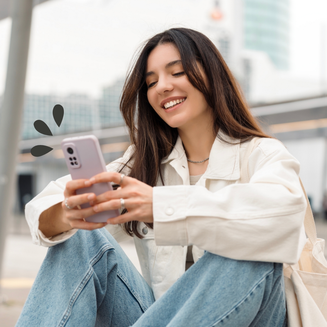 Young woman using her phone to access mobile banking