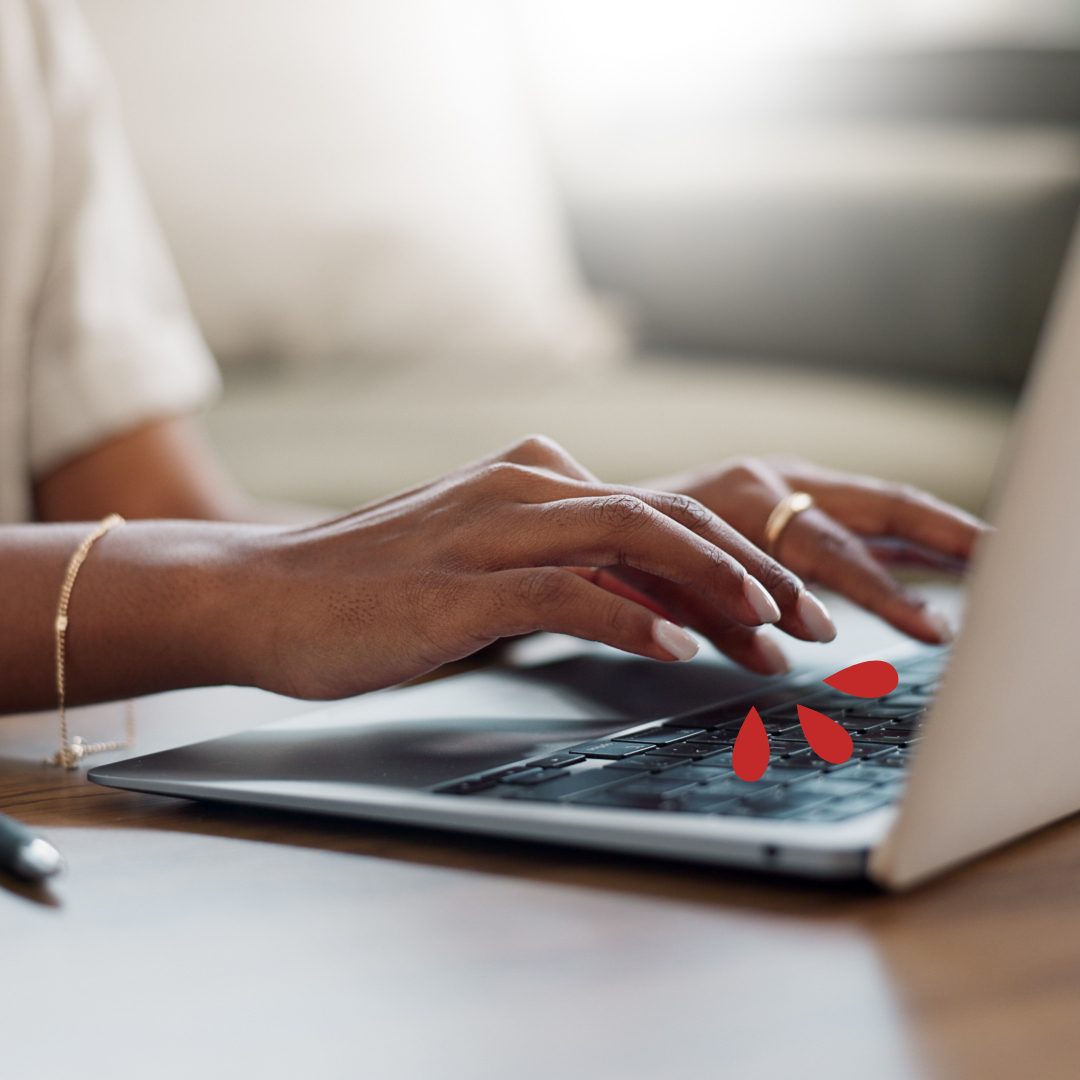 Woman emailing document on a laptop