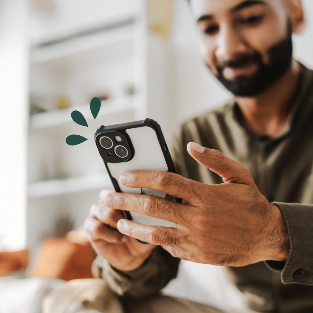 Zelle Man sending money using Zelle on his device at home