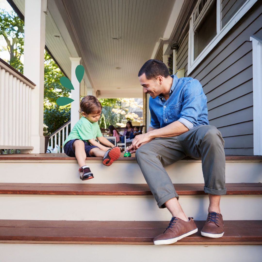 Home Equity Loans and HELOCs Father and child playing on the steps of their homes porch